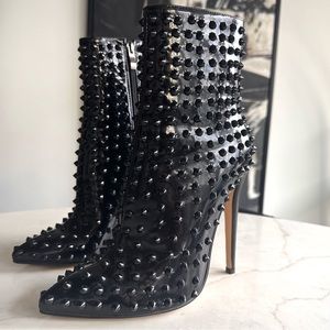 Black spiked patent faux leather booties with pointed toe